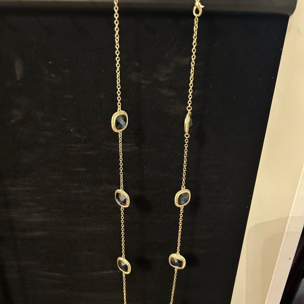 Long, Gold strand with rectangular blue stones.